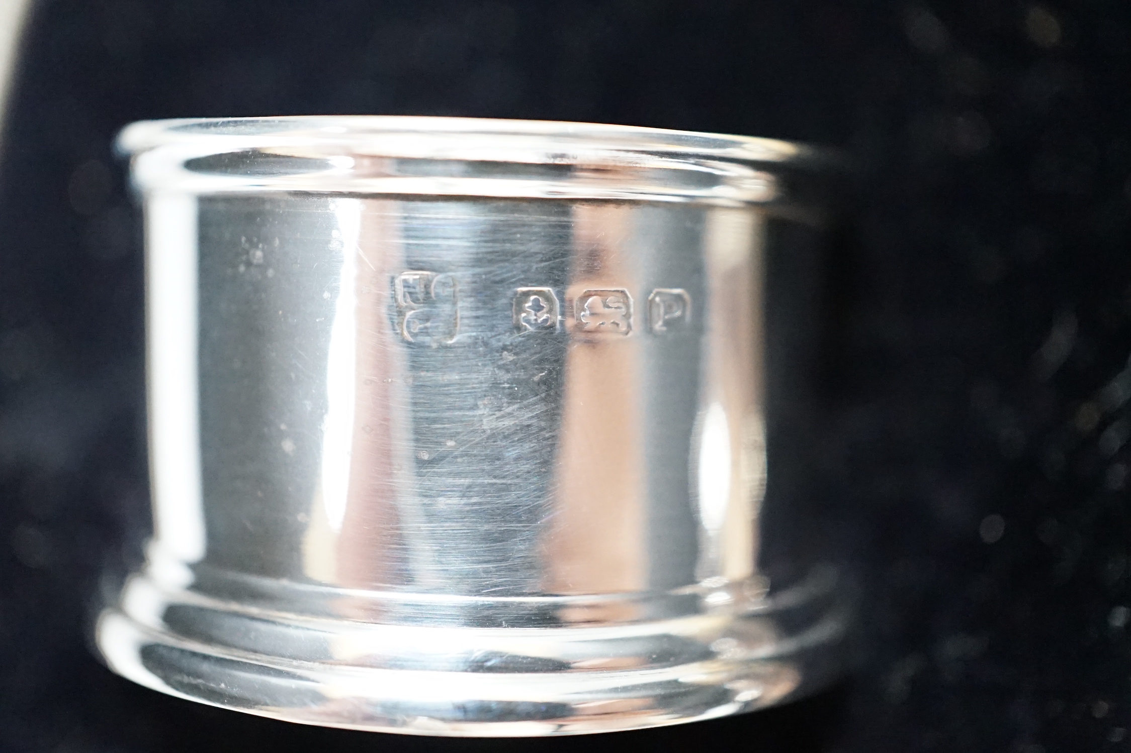 A George VI cased silver three piece condiment set and two spoons, Birmingham 1939